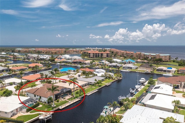 birds eye view of property featuring a water view