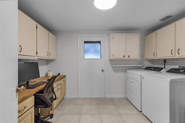 laundry room with washer and clothes dryer and cabinets