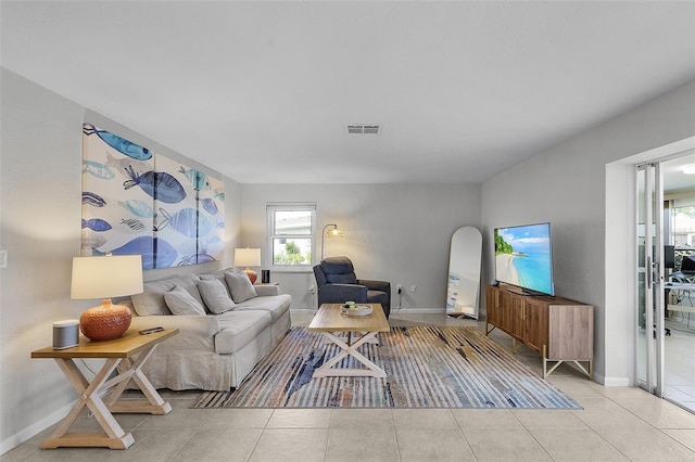 living room with light tile patterned flooring