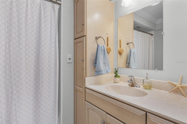 bathroom with vanity and ornamental molding