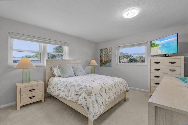 bedroom featuring light colored carpet