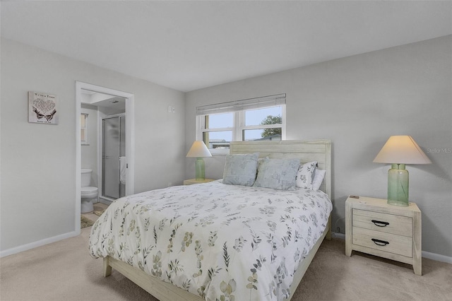 carpeted bedroom with ensuite bath