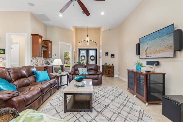 living room with ceiling fan, french doors, and light tile patterned floors