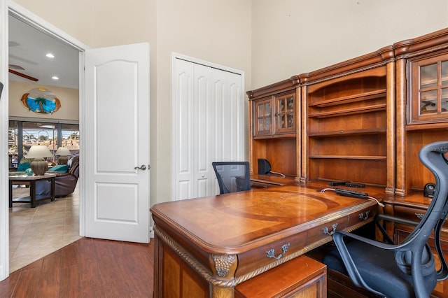 office space with ceiling fan and dark wood-type flooring