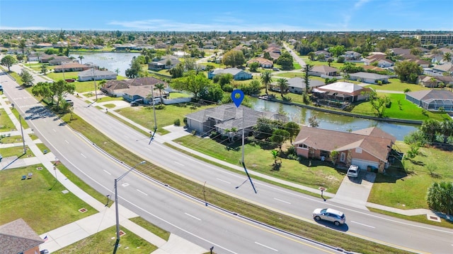 228 Nicholas Pkwy E, Cape Coral, FL 33990 - bird's eye view with a water view and a residential view