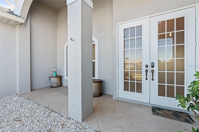 228 Nicholas Pkwy E, Cape Coral, FL 33990 - entrance to property with a patio, stucco siding, and french doors