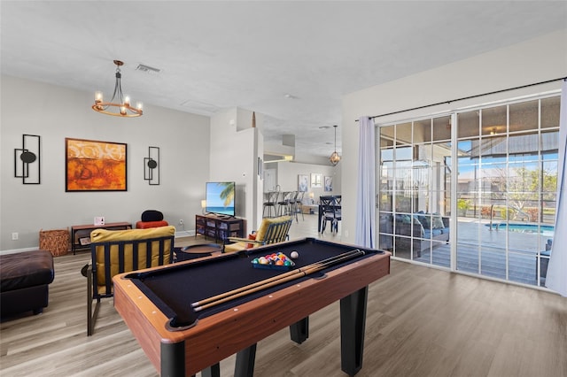 228 Nicholas Pkwy E, Cape Coral, FL 33990 - recreation room featuring billiards, light wood finished floors, baseboards, and a chandelier
