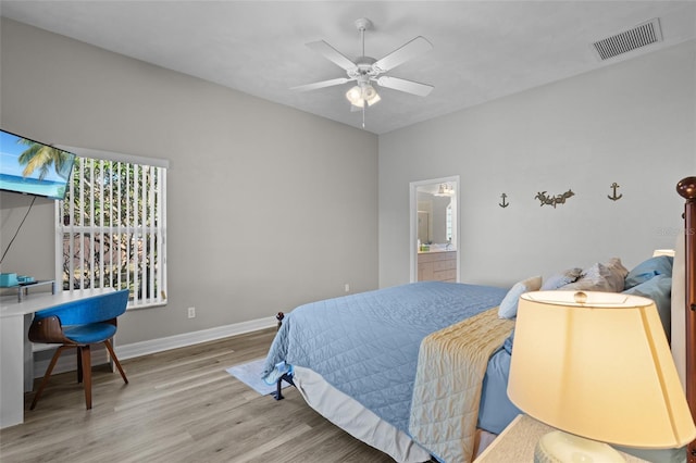 228 Nicholas Pkwy E, Cape Coral, FL 33990 - bedroom with baseboards, ceiling fan, wood finished floors, and visible vents