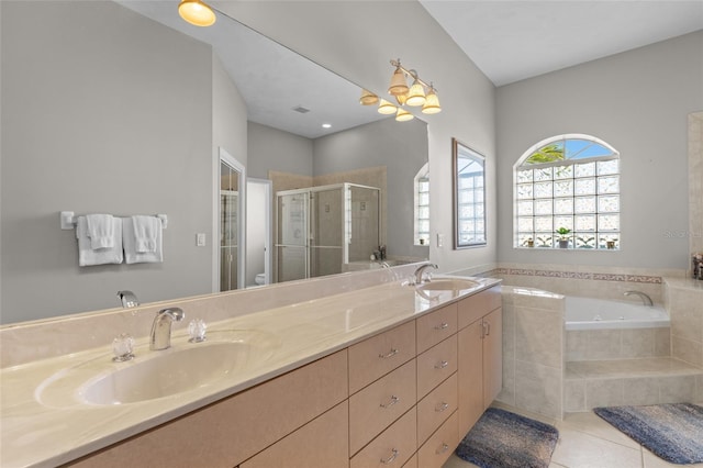 228 Nicholas Pkwy E, Cape Coral, FL 33990 - bathroom featuring double vanity, a sink, a bath, and a stall shower