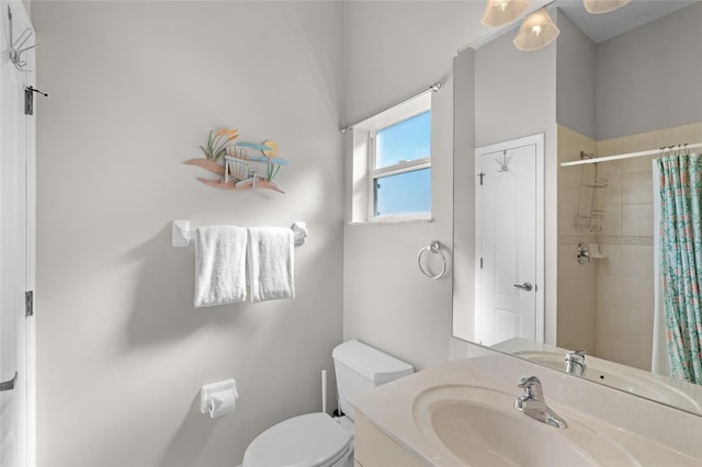 228 Nicholas Pkwy E, Cape Coral, FL 33990 - bathroom with toilet, a tile shower, and vanity