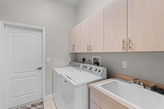 228 Nicholas Pkwy E, Cape Coral, FL 33990 - clothes washing area with cabinet space, separate washer and dryer, light tile patterned flooring, and a sink