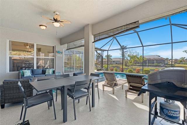 228 Nicholas Pkwy E, Cape Coral, FL 33990 - sunroom / solarium with an outdoor hangout area, outdoor dining area, and a ceiling fan