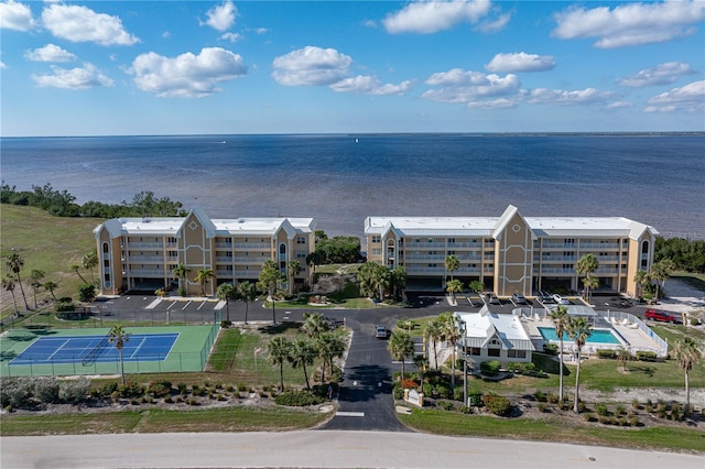 birds eye view of property with a water view