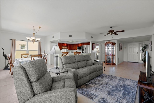 living room featuring ceiling fan with notable chandelier and light tile patterned flooring