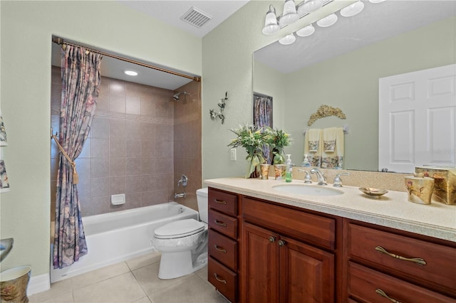 full bathroom featuring tile patterned floors, shower / bath combination with curtain, toilet, and vanity