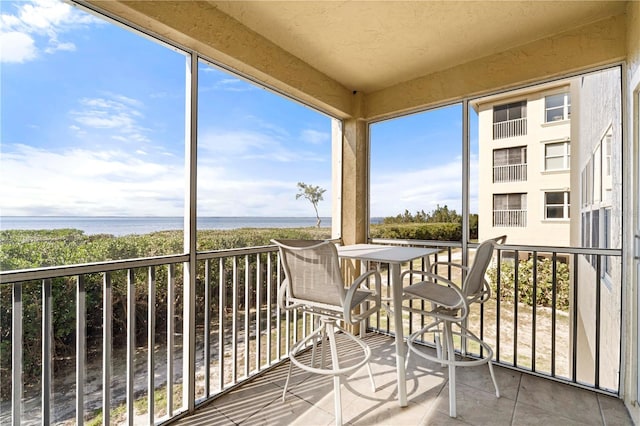 balcony featuring a water view