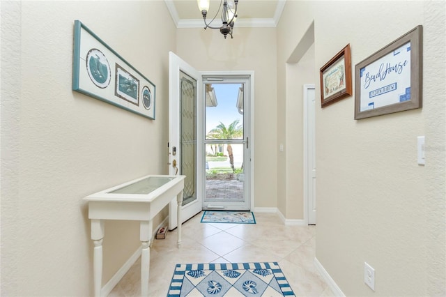 foyer entrance with crown molding, light tile patterned flooring, and a chandelier