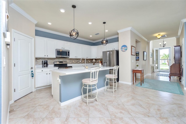 kitchen with stainless steel appliances, light tile patterned floors, tasteful backsplash, pendant lighting, and white cabinets