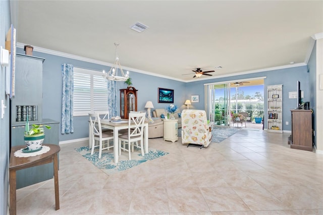 dining room featuring ceiling fan with notable chandelier, light tile patterned floors, and crown molding