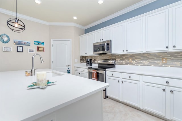 kitchen featuring appliances with stainless steel finishes, sink, light tile patterned floors, pendant lighting, and white cabinets