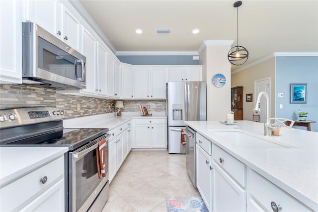 kitchen featuring white cabinetry, sink, stainless steel appliances, and ornamental molding