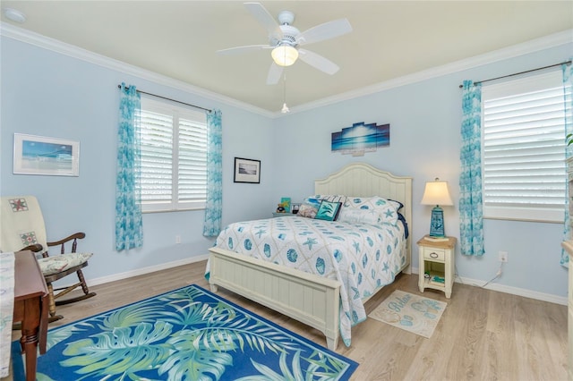 bedroom with ceiling fan, light hardwood / wood-style flooring, and ornamental molding