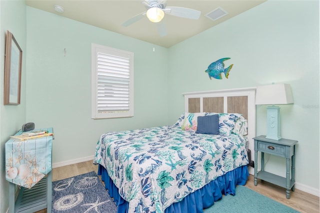 bedroom with ceiling fan and light hardwood / wood-style flooring