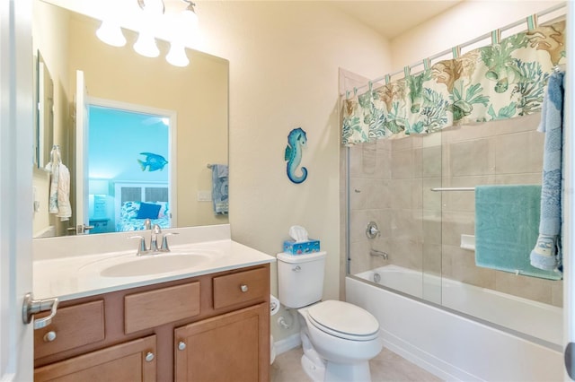 full bathroom featuring tile patterned floors, vanity, toilet, and bath / shower combo with glass door