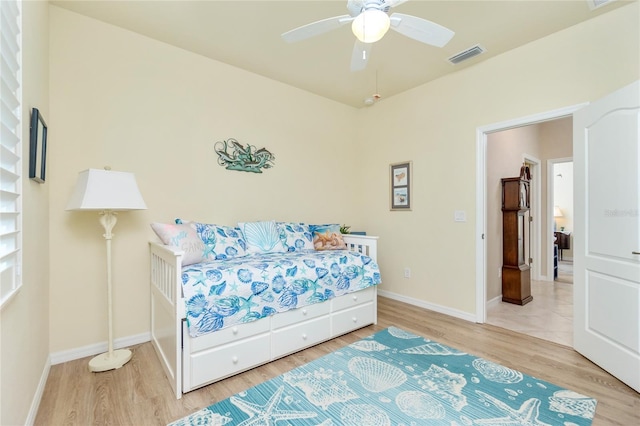 bedroom featuring hardwood / wood-style floors and ceiling fan