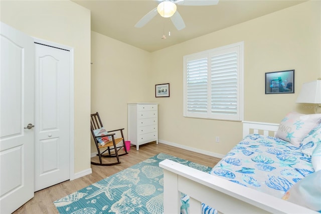 bedroom featuring a closet, ceiling fan, and light hardwood / wood-style flooring