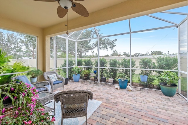 sunroom / solarium with ceiling fan