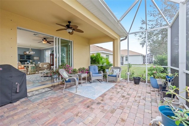 view of patio with ceiling fan and a lanai