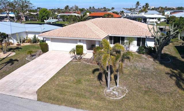 view of front facade with a front yard and a garage