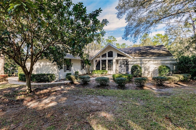 view of front of home featuring a sunroom