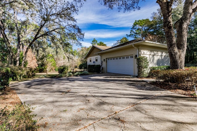 view of side of property with a garage