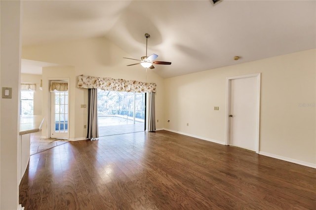 empty room featuring ceiling fan, dark hardwood / wood-style flooring, and lofted ceiling