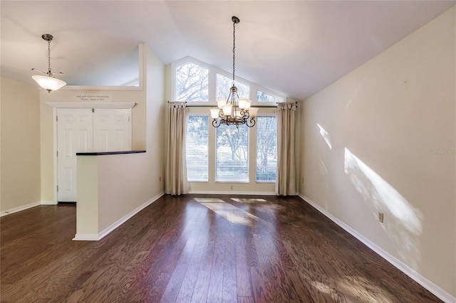 unfurnished dining area featuring high vaulted ceiling, dark hardwood / wood-style floors, and an inviting chandelier