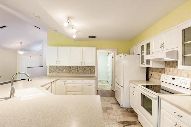 kitchen with white cabinetry, sink, hanging light fixtures, backsplash, and white appliances