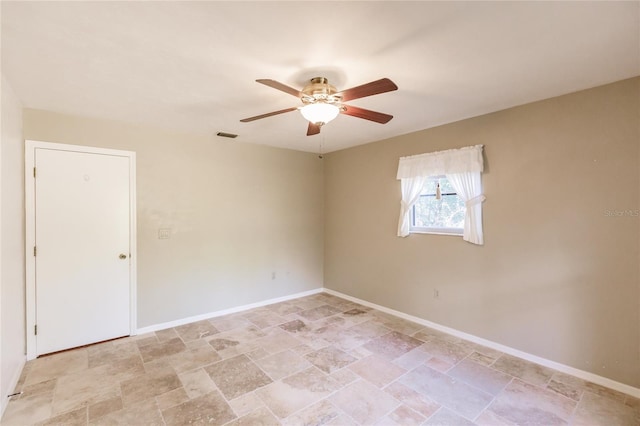 spare room with ceiling fan