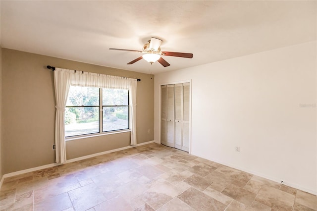 unfurnished room with ceiling fan