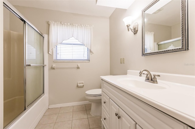 full bathroom with tile patterned flooring, vanity, toilet, and combined bath / shower with glass door