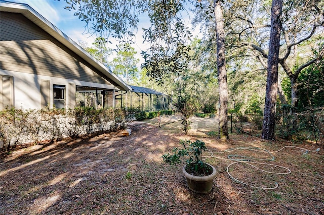 view of yard with a lanai