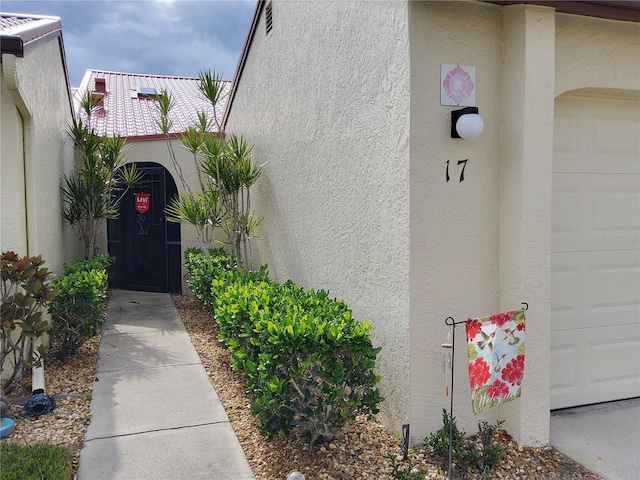 property entrance featuring a garage