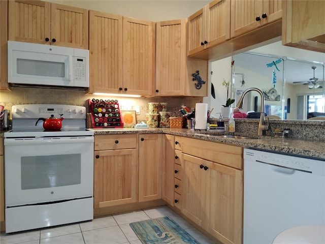 kitchen featuring backsplash, sink, white appliances, light brown cabinets, and light tile patterned floors