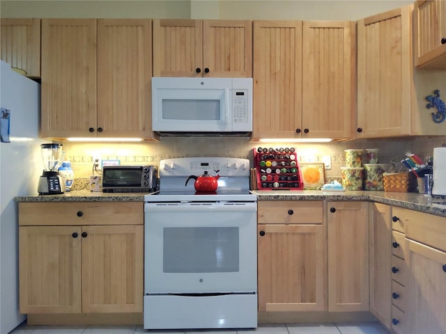 kitchen with light brown cabinetry, light tile patterned flooring, decorative backsplash, and white appliances