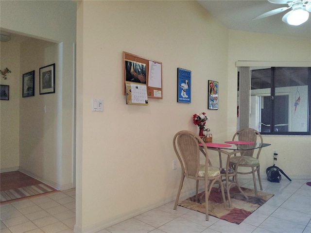 tiled dining space featuring ceiling fan