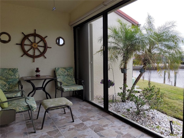 sunroom with a water view