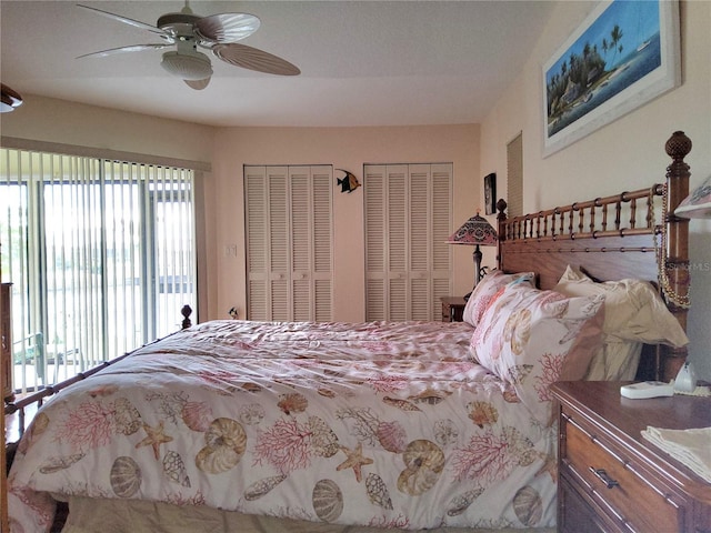 bedroom featuring ceiling fan and two closets