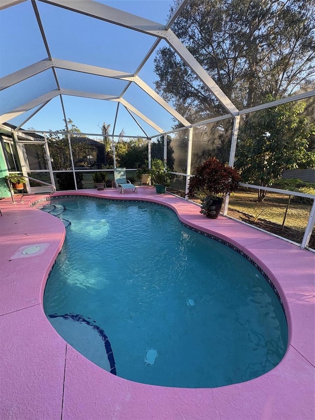 view of pool featuring a lanai