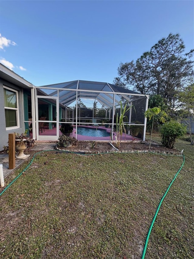 view of yard with a lanai